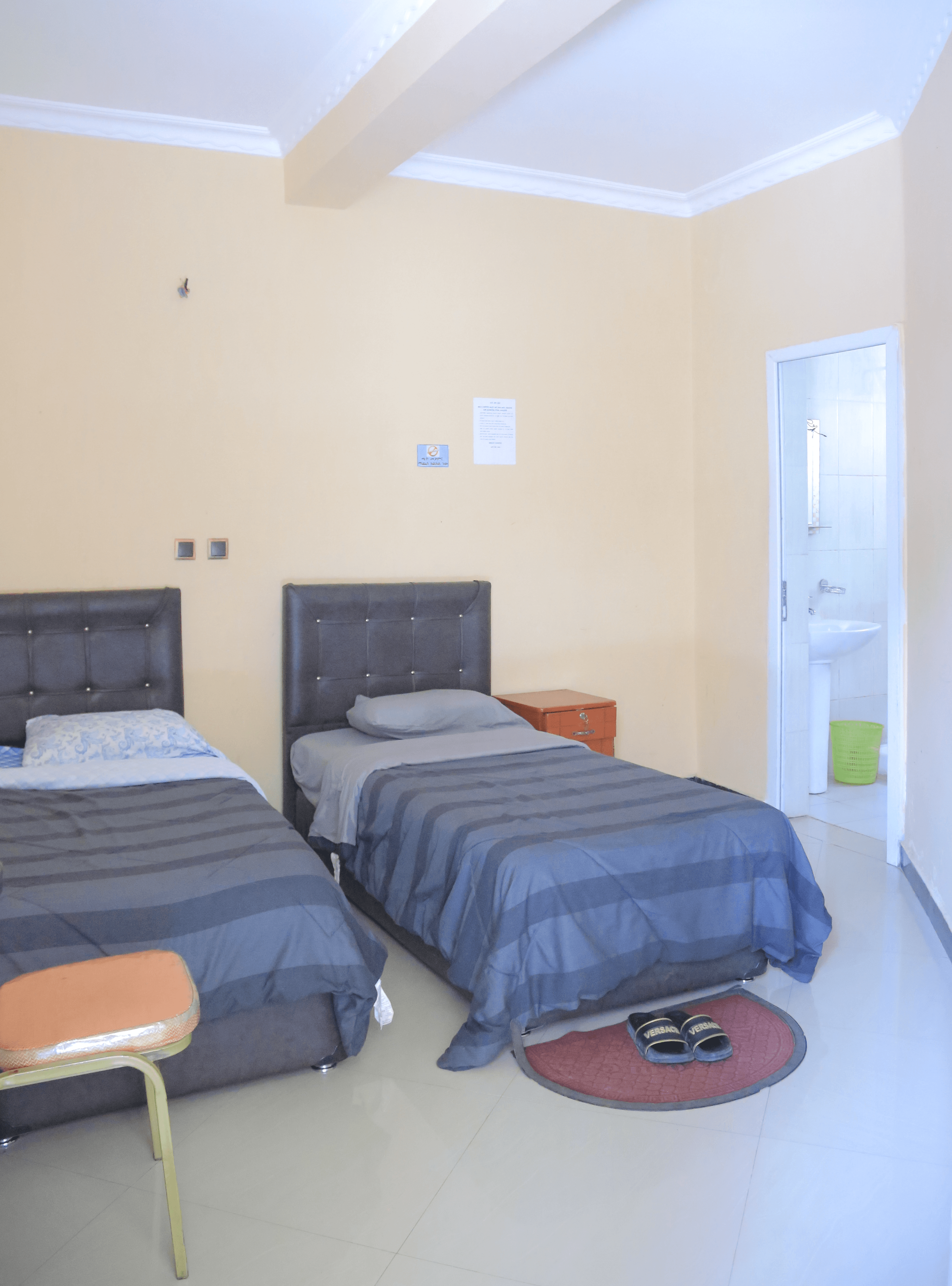 Well-furnished 2 bedroom with two queen beds and a comfortable living area in liyat guest house